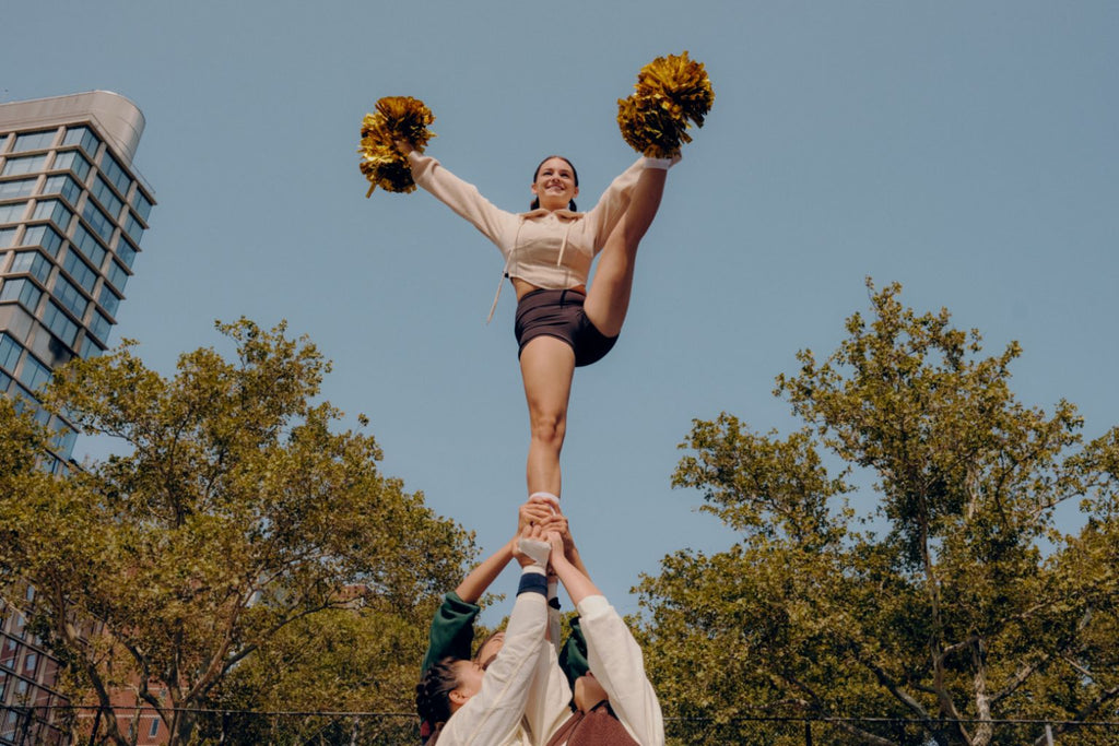 cheerleader wearing Kt by Knix period-proof activewear