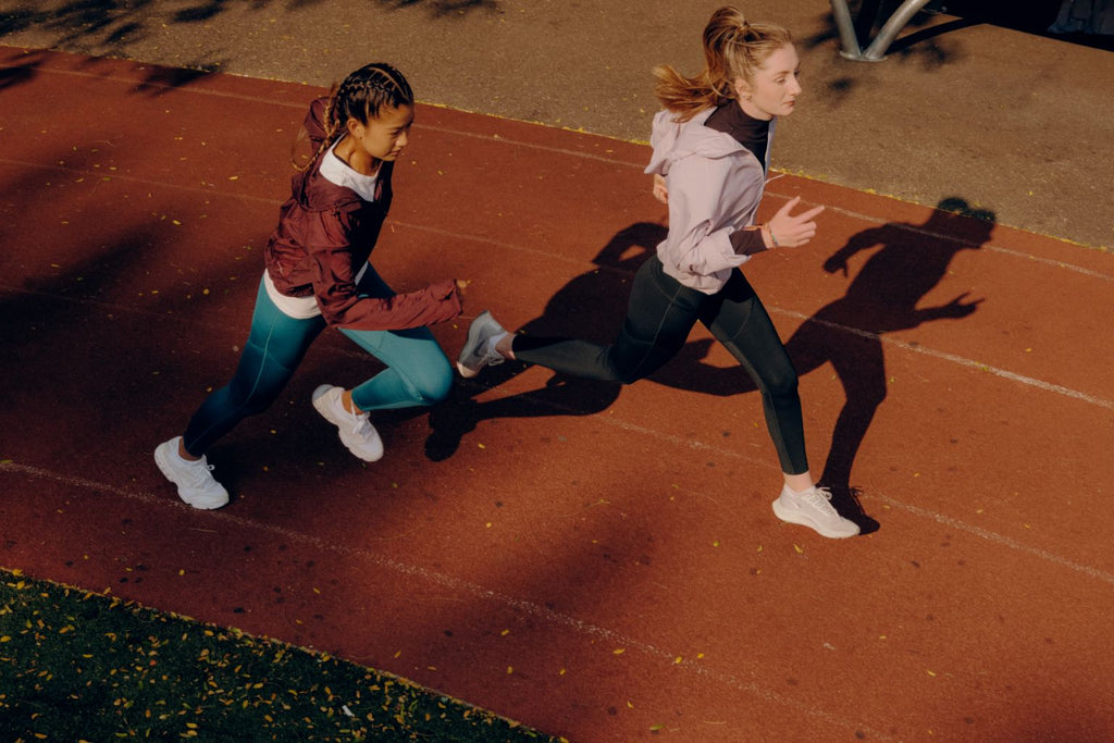 young athletes running track in period-proof activewear