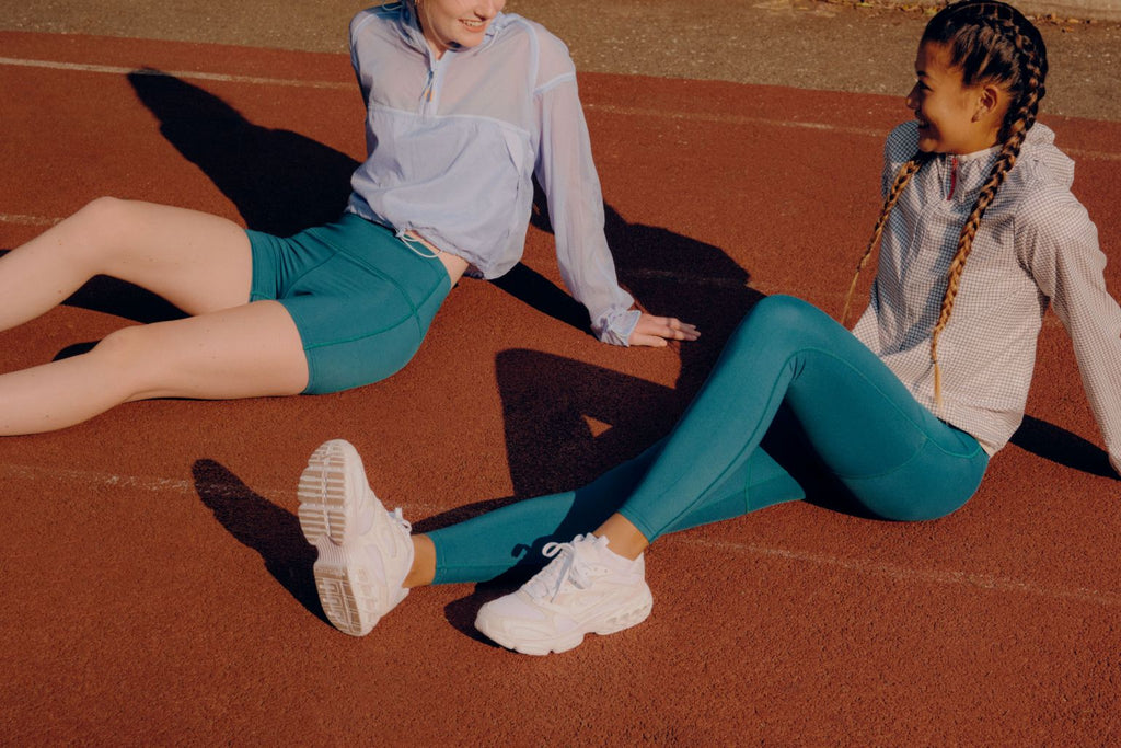 girls wearing teal period-proof leggings