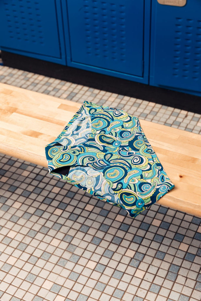 Period underwear sitting on a bench in a school locker room