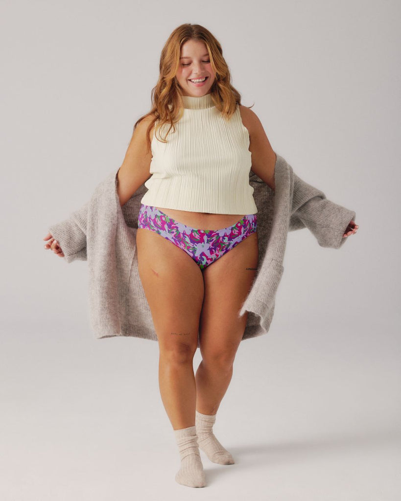 woman wearing sweater and patterned period underwear