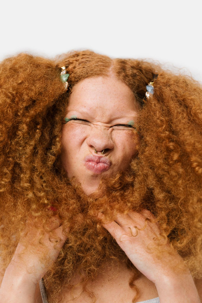 close-up image of teen scrunching their nose