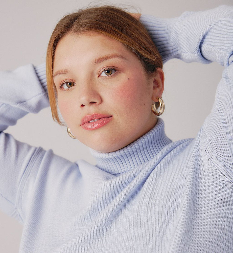 smiling teen wearing turtleneck